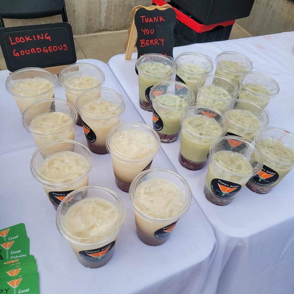 Rows of Poppy Boba Kitchen's Vietnamese boba tea drinks with black and green tea flavors.